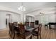 Well-lit dining room featuring wood floors and an open floor plan at 1876 E Azalea Ct, Gilbert, AZ 85298