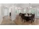 Well-lit dining room featuring wood floors and an open floor plan at 1876 E Azalea Ct, Gilbert, AZ 85298