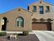 Charming two-story home with a well-maintained yard and attached two-car garage, offering comfort and convenience at 1876 E Azalea Ct, Gilbert, AZ 85298