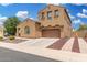 Charming two-story home with an attached two-car garage and low maintenance yard at 1876 E Azalea Ct, Gilbert, AZ 85298