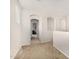 Upstairs hallway with neutral carpet, arched doorways, and natural light at 1876 E Azalea Ct, Gilbert, AZ 85298