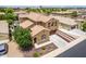 Aerial shot showcasing a home with a tile roof, neat landscaping, and a driveway, in a suburban neighborhood at 1876 E Azalea Ct, Gilbert, AZ 85298