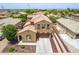 Aerial view of a single-Gathering home featuring a tile roof and a well-maintained driveway with desert landscaping at 1876 E Azalea Ct, Gilbert, AZ 85298