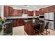 Modern kitchen featuring stainless steel appliances, a center island with seating, and granite counters at 1876 E Azalea Ct, Gilbert, AZ 85298