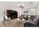 Cozy living room featuring a large sectional, entertainment center, and natural lighting at 1876 E Azalea Ct, Gilbert, AZ 85298