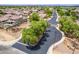 This street view shows the entrance into the subdivision with landscaping and a block wall fence at 1876 E Azalea Ct, Gilbert, AZ 85298