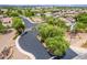 Street view through the subdivision entrance showing landscaping and block wall fencing at 1876 E Azalea Ct, Gilbert, AZ 85298