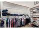 This walk-in closet features ample space for clothes, shelves, and shoes at 1876 E Azalea Ct, Gilbert, AZ 85298