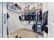 This walk-in closet features shelving and hanging rods providing plenty of space for clothes at 1876 E Azalea Ct, Gilbert, AZ 85298