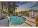 Backyard area with pool and spa, desert landscaping, and covered patio at 1882 W Wildhorse Dr, Chandler, AZ 85286