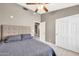 Bedroom with a ceiling fan, walk-in closet and ensuite bathroom at 1882 W Wildhorse Dr, Chandler, AZ 85286