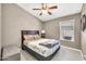 Cozy bedroom with a ceiling fan and plenty of natural light at 1882 W Wildhorse Dr, Chandler, AZ 85286
