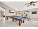 Spacious game room featuring a pool table, shuffleboard, wet bar, and modern finishes at 1882 W Wildhorse Dr, Chandler, AZ 85286