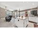 Open-concept kitchen includes granite countertops, a central island, and modern appliances at 1882 W Wildhorse Dr, Chandler, AZ 85286