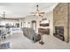 Open-concept living room features tile floors, stone fireplace and flows into the kitchen at 1882 W Wildhorse Dr, Chandler, AZ 85286