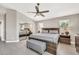 Spacious main bedroom showcasing a large bed, sliding-door closet and tiled floors at 1882 W Wildhorse Dr, Chandler, AZ 85286