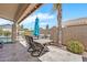 Outdoor patio features a dining table and chairs near the pool at 1882 W Wildhorse Dr, Chandler, AZ 85286