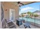 Covered patio seating area with ceiling fan and view of the refreshing pool at 1882 W Wildhorse Dr, Chandler, AZ 85286