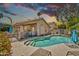 Beautiful pool in backyard with desert landscaping and patio area at 1882 W Wildhorse Dr, Chandler, AZ 85286