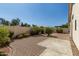 Paver stone patio, block wall and mature landscaping create an attractive outdoor living area at 20424 N 96Th Ln, Peoria, AZ 85382