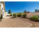 Brick-paved backyard surrounded by shrubbery, ideal for outdoor relaxation at 20424 N 96Th Ln, Peoria, AZ 85382