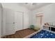 Bright bedroom features hardwood floors, a bed, and a sliding door closet at 20424 N 96Th Ln, Peoria, AZ 85382