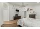 Inviting bedroom features a modern dresser, a ceiling fan, and a walk in closet at 20424 N 96Th Ln, Peoria, AZ 85382
