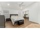 Relaxing bedroom features a mirrored closet, vaulted ceilings, a ceiling fan, and neutral decor at 20424 N 96Th Ln, Peoria, AZ 85382