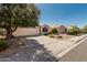 Charming single-story home featuring a two-car garage and desert landscaping at 20424 N 96Th Ln, Peoria, AZ 85382
