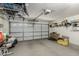 Spacious garage with white door, overhead storage and plenty of room for parking at 20424 N 96Th Ln, Peoria, AZ 85382