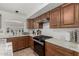 The kitchen has stainless steel appliances, marble countertops, and a gas cooktop at 20424 N 96Th Ln, Peoria, AZ 85382