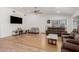 Spacious living room with hardwood floors, vaulted ceilings, and plenty of natural light at 20424 N 96Th Ln, Peoria, AZ 85382