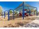 Community playground featuring slides, swings, and a covered play area for children at 20424 N 96Th Ln, Peoria, AZ 85382