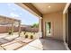 Covered patio with views of the landscaped backyard, offering a peaceful outdoor space at 21031 E Poco Calle St, Queen Creek, AZ 85142