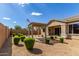 Private backyard with gravel, lush bushes, and pergola, perfect for outdoor enjoyment at 21031 E Poco Calle St, Queen Creek, AZ 85142