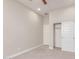 Cozy bedroom featuring neutral walls, carpet flooring, and a closet with sliding doors at 21031 E Poco Calle St, Queen Creek, AZ 85142