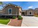 Well-maintained home with lush landscaping and a cozy, inviting entrance at 21031 E Poco Calle St, Queen Creek, AZ 85142