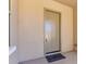 Elegant front door with a welcome mat in a modern home exterior at 21031 E Poco Calle St, Queen Creek, AZ 85142