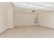 Spacious garage with epoxy flooring and ample space for vehicles and storage solutions at 21031 E Poco Calle St, Queen Creek, AZ 85142