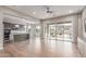 Open-concept living space featuring wood floors and a large sliding glass door to the backyard at 21031 E Poco Calle St, Queen Creek, AZ 85142