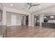 Spacious open floor plan connecting the living room, kitchen, and dining area with modern decor at 21031 E Poco Calle St, Queen Creek, AZ 85142