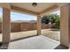 Covered patio overlooking fenced in backyard at 21299 E Roundup Way, Queen Creek, AZ 85142