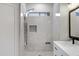 Updated bathroom featuring a tile shower and modern fixtures at 21299 E Roundup Way, Queen Creek, AZ 85142