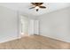 Spacious bedroom featuring an updated ceiling fan and wood-look flooring at 21299 E Roundup Way, Queen Creek, AZ 85142