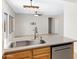 Open-concept kitchen with stone countertops and stainless steel dishwasher at 21299 E Roundup Way, Queen Creek, AZ 85142