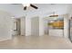 Bright, open living space with tile floors connecting to the kitchen, perfect for entertaining and daily living at 21299 E Roundup Way, Queen Creek, AZ 85142