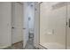 Clean bathroom featuring a glass-enclosed shower, toilet, and white fixtures at 21711 E Arroyo Verde Dr, Queen Creek, AZ 85142