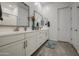 Bright bathroom with double sinks, granite countertops, modern fixtures, and tile floors at 21711 E Arroyo Verde Dr, Queen Creek, AZ 85142