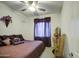 Cozy bedroom with neutral colors and a ceiling fan at 21711 E Arroyo Verde Dr, Queen Creek, AZ 85142
