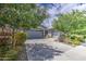 Beautiful home with a long driveway, a two-car garage, and professional landscaping at 21711 E Arroyo Verde Dr, Queen Creek, AZ 85142